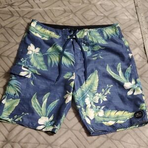O'Neill Men's Board Shorts featuring a blue and green tropical floral Hawaiian